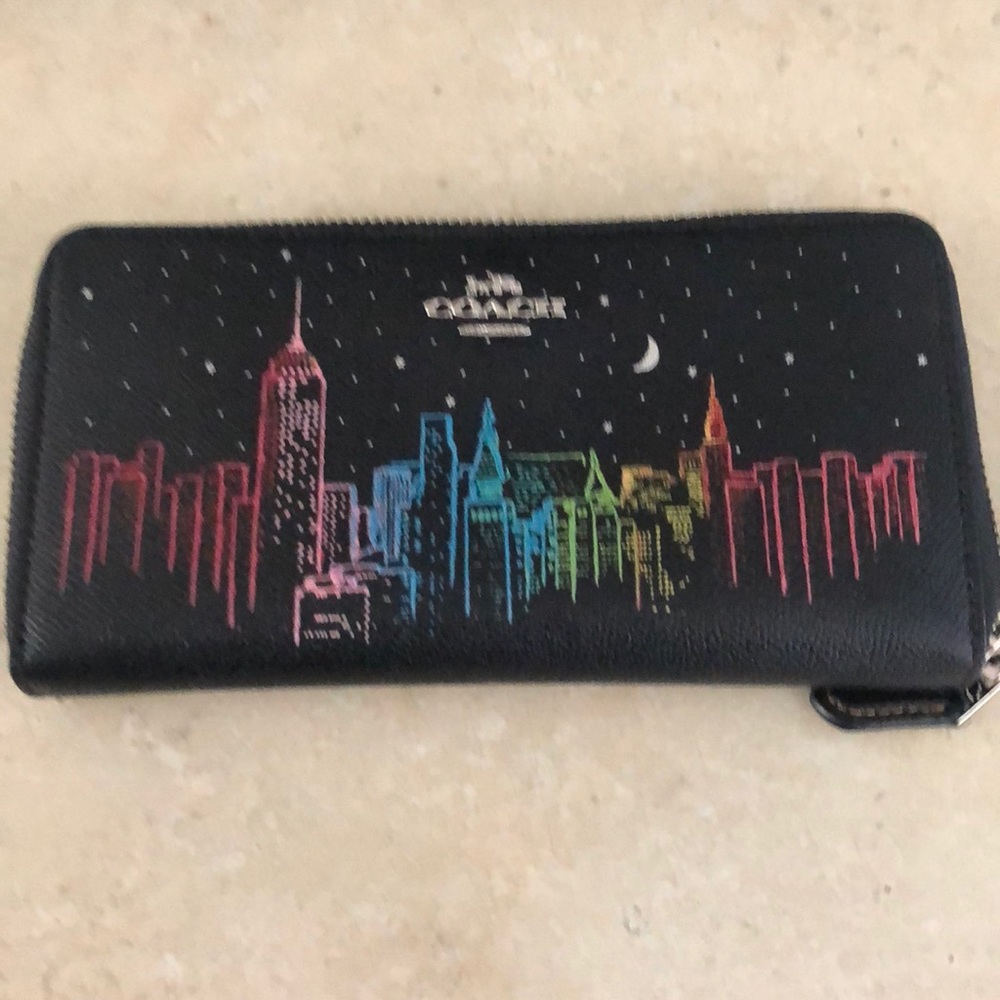 Gently used Coach Skyline accordion zip wallet